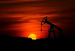 Oil derrick during sunset