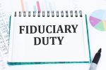 Text Fiduciary Duty on notepad in front of an office desk