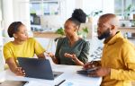 Business meeting, black people and startup with man, woman and laptop with discussion, strategy and planning. Businessman, women and computer with collaboration, corporate teamwork and focus at desk. Challenging a will concept.